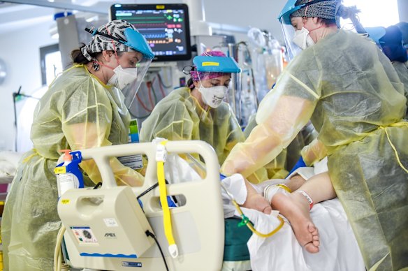 ICU nurses at work on a patient. 