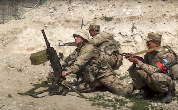 Azerbaijan's soldiers fire from a mortar at the contact line of the self-proclaimed Republic of Nagorno-Karabakh, Azerbaijan. 