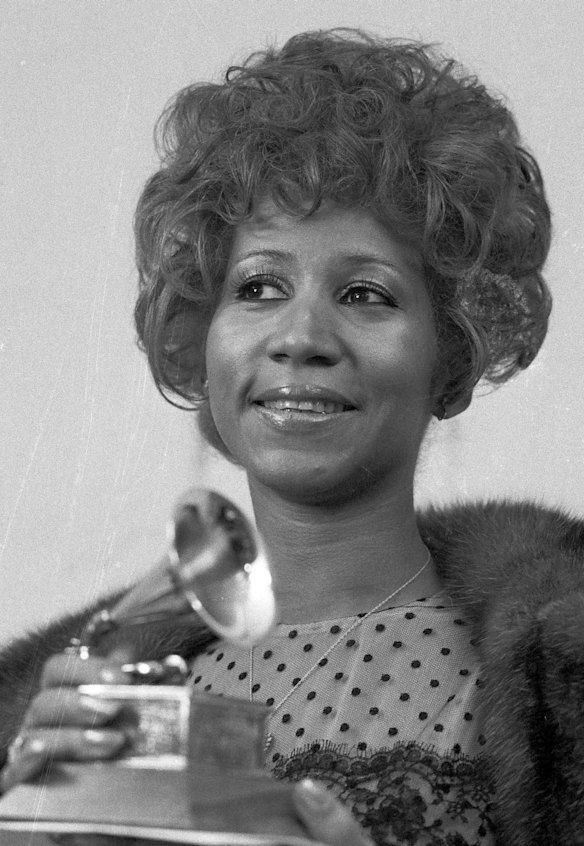 In this March 13, 1972 file photo, Aretha Franklin holds her Grammy Award for Best Rhythm and Blues performance of the song "Bridge Over Troubled Waters," in New York. 