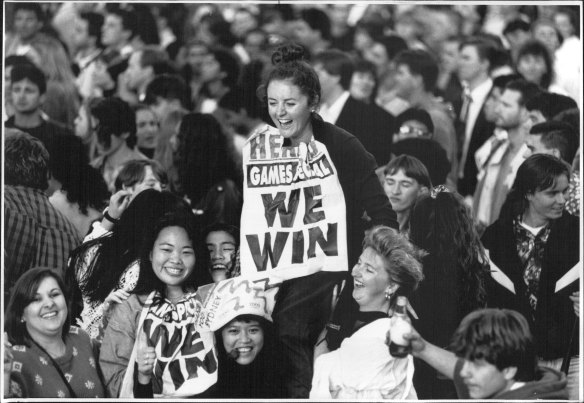 Joanne Hales with an early poster depicting Sydney's win, September 24, 1993.