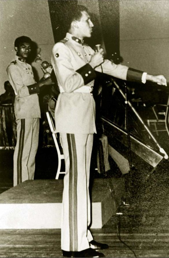 In this undated photo released by Miraflores Press Office, Hugo Chavez, right, sings folkloric Venezuelan music during an event at the military academy in Caracas, Venezuela.