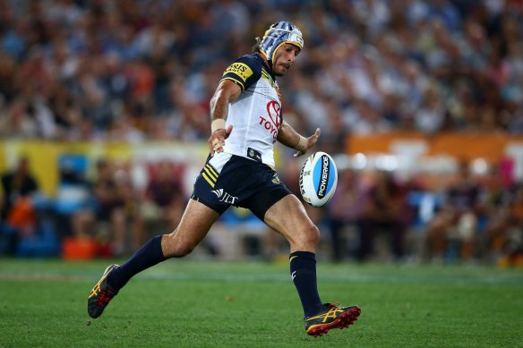 The moment: Johnathan Thurston on his way to nailing the match-winning field goal in golden point extra time in the 2015 grand final.