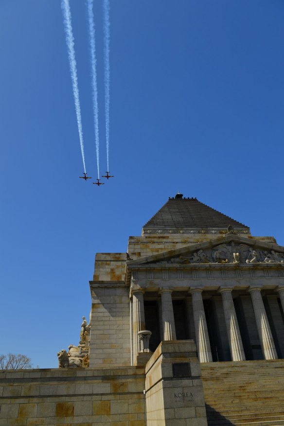 RAAF training aircraft fly over the Shrine on Friday. 