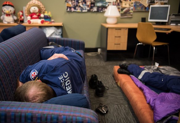 4:26am. NSW Ambulance Paramedics take a rest at the Eveliegh Station after a busy evening shift.