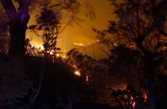 Fire and embers fill the landscape along the Bells Line of Road west of Mt Tomah late last night.