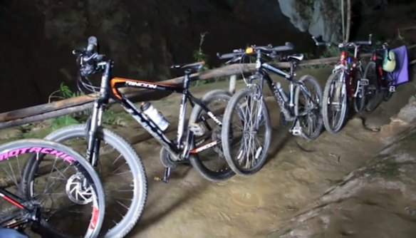 Bicycles left from a group of boys who went missing stand parked outside a deep cave in Chang Rai, northern Thailand.

