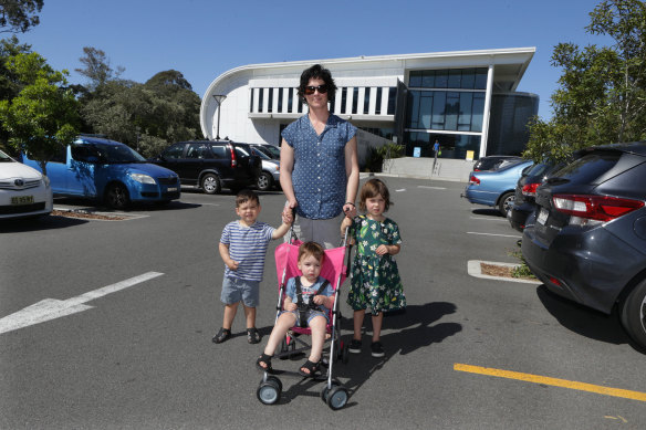 Bridget Murphy with her children Tamsin, four; Rhys, two; and Kieran, one; outside the pool in Bexley.