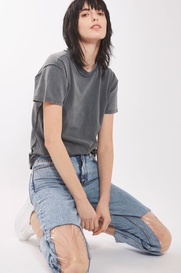 Topshop previously released a pair of jeans with plastic windows in the knees.