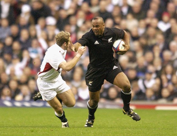 Jonah Lomu of New Zealand goes past James Simpson-Daniel of England during the England v New Zealand Investec Challenge match on 9th November, 2002 at Twickenham, England.