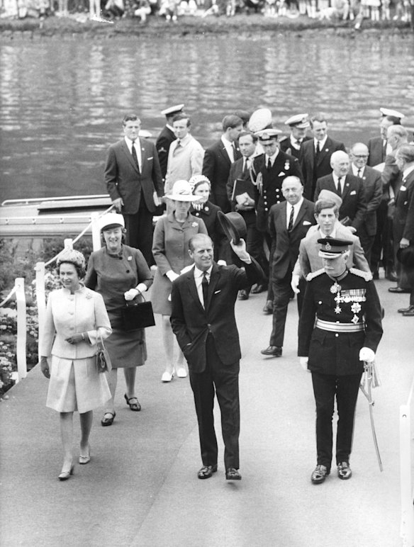 The Queen, Duke of Edinburgh and Sir Rohan Delacombe. Behind them walk Princess Anne and Prince Charles, Sir Henry Bolte also, behind Prince Charles. 14th April, 1970.