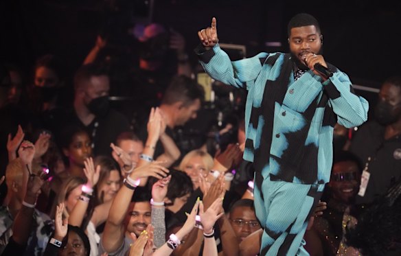 Khalid performs in Homme Plissé Issey Miyake.