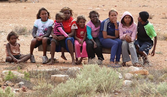 Children eagerly await the arrival of entertainer, Jessica Mauboy to perform at Watson on The Nullabor Plain in South Australia for children from Oak Valley Aboriginal School.