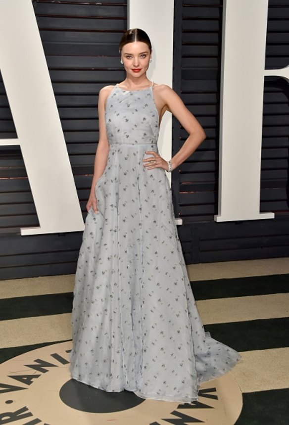 Channelling old Hollywood glamour, Miranda Kerr stunned at Vanity Fair's party in a powder blue MiuMiu gown with floral embellishment and an elegant pearl crossed back. 