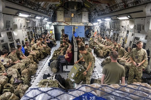 Members of Joint Forces Headquarters get prepared to deploy to Afghanistan to assist in the draw down from the area in this handout photo issued by the Ministry of Defence (MoD). With security rapidly deteriorating in Afghanistan, the United States planned to send in 3,000 troops to help evacuate some personnel from the U.S. Embassy in Kabul. Britain and Canada are also sending forces to aid their evacuations. 