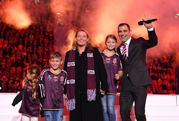 Former Queensland Maroons captain Cameron Smith (right) stands with his family as he is given a farewell after retiring from Origin prior to Game 1.