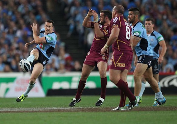 Mitchell Pearce kicks for touch.