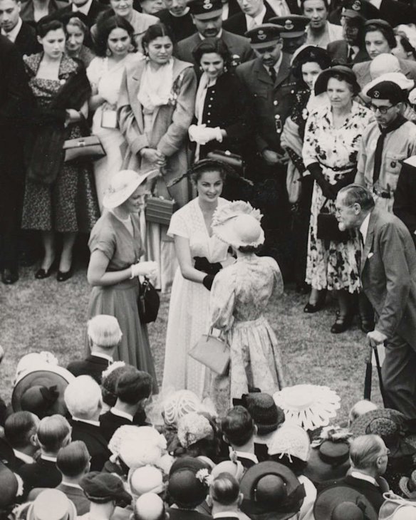 Miss NSW Maureen Duval is introduced to the Queen at a royal garden party in the grounds of Buckingham Palace in 1952.