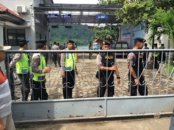 Armed police outside the harbour in Cilacap where Andrew Chan and Myuran Sukumaran were ferried to Nusakambangan island.