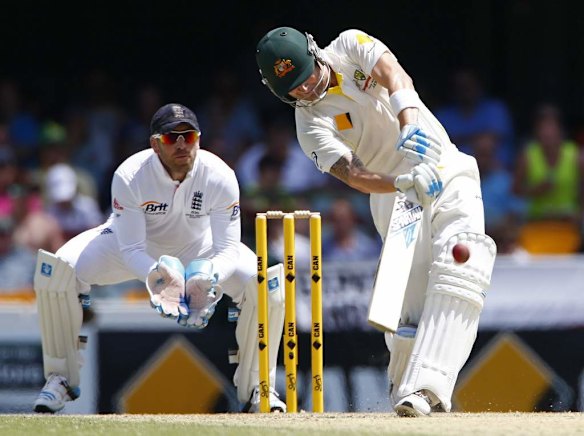 Australia's captain Michael Clarke (R) hits a six next to England's wicket keeper Matt Prior.