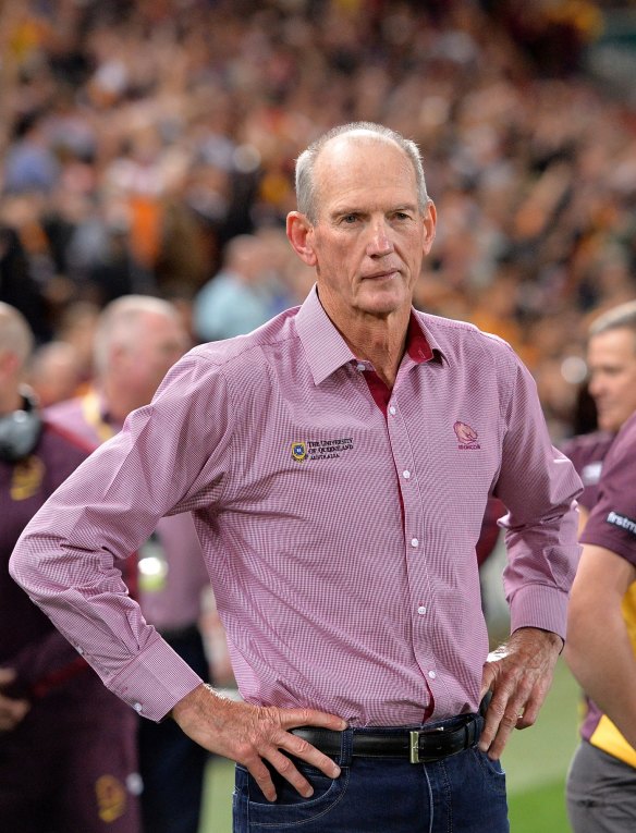 Is that a hint of a smile: Broncos coach Wayne Bennett watches on as his team celebrates victory over the Roosters.