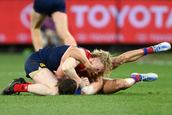 Jarrod Berry and Clayton Oliver scuffle in the third term on Friday night.