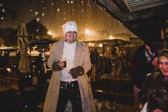 Crowds inside The Rails Hotel. Those that couldn't fit under the structure stood out in the rain.