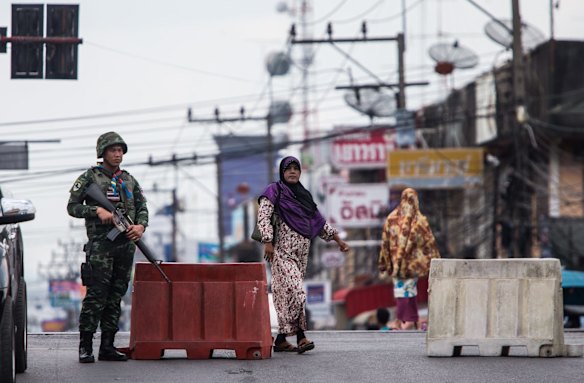 Thai soldiers on alert in the streets of Yala after insurgents bombed it multiple times in mid May. 
