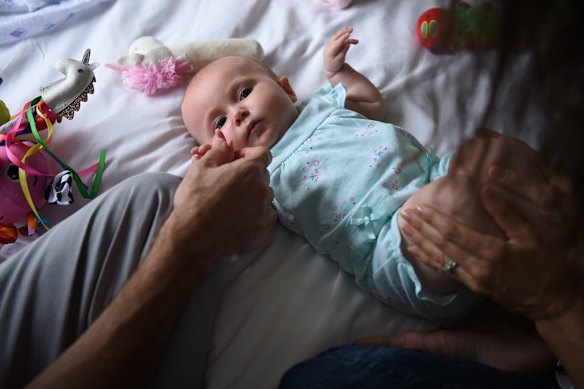 Six month old Aviana McElwee with her parents in their room at Ronald McDonald House in Randwick, Sydney.