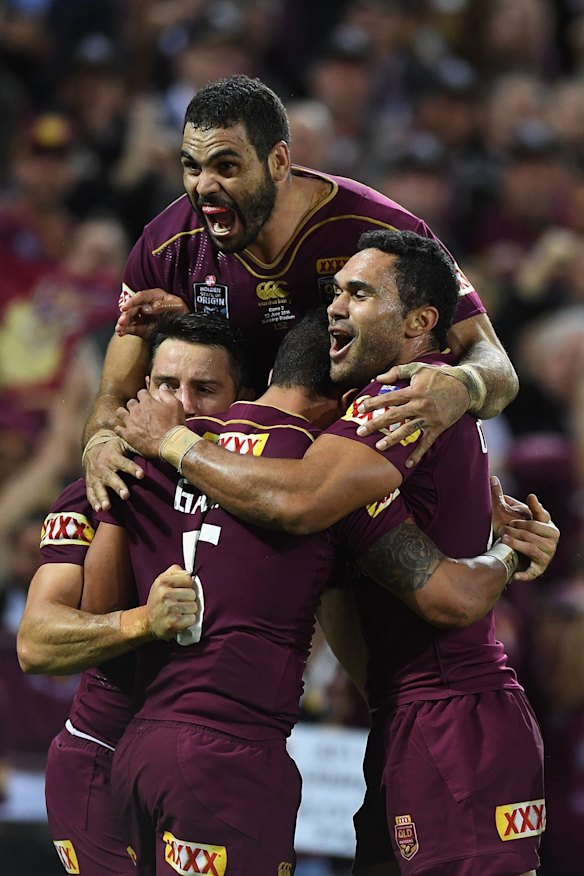 Dane Gagai of the Maroons celebrates scoring a try with Cooper Cronk, Greg Inglis and Justin O'Neill