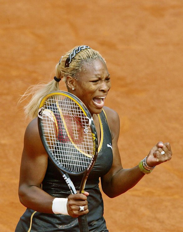 2002 French Open - Serena Williams celebrates after winning the French Open against her sister Venus.