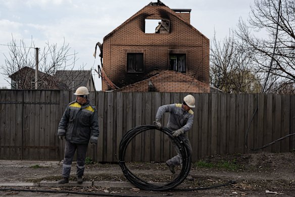 Electricians repair cables in Horenka, near Kyiv.