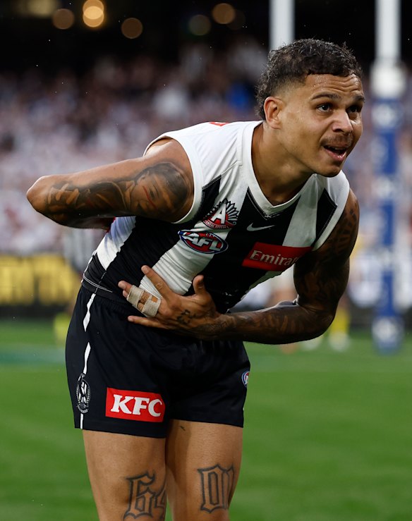 Boby Hill take a bow. The Collingwood small forward celebrates after a goal.