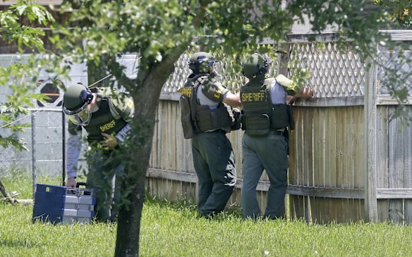 Bomb disposal officers check for bombs at an apartment complex possibly linked to the fatal shootings at an Orlando nightclub.