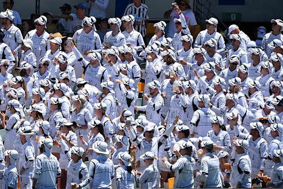 Spectators in the crowd enjoy the atmosphere during day four of the First Test Match in the Ashes series between Australia and England at The Gabba on December 11, 2021 in Brisbane, Australia. 