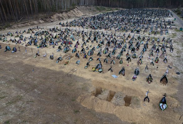 Three more graves prepared for the next funerals at the cemetery in Irpin.