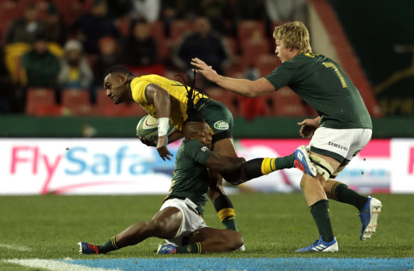 Tevita Kuridrani, left, is tackled by South Africa's S'bu Nkosi.