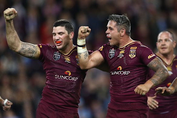 Matt Gillett and Corey Parker of the Maroons celebrate victory during game two 