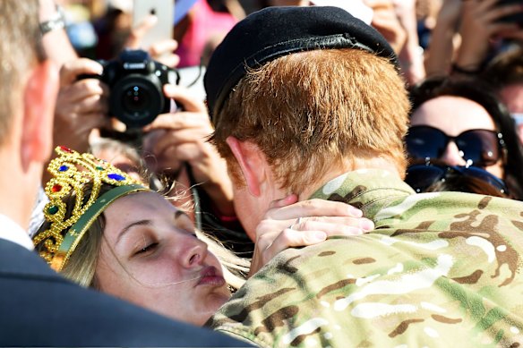 Britain's Prince Harry receives a kiss 