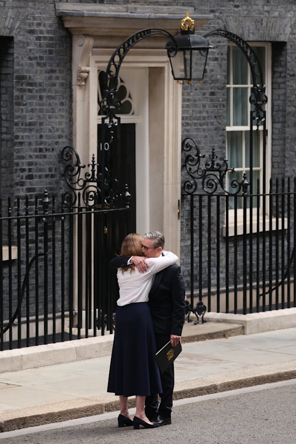 British Prime Minister Keir Starmer hugs his wife, Victoria Starmer, after announcing his resignation.