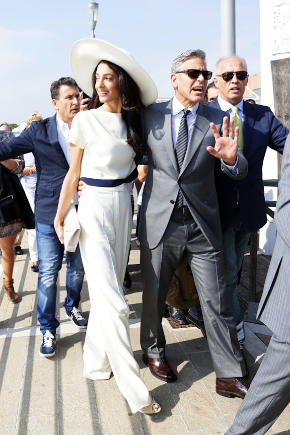 Amal Clooney in a custom Stella McCartney suit with matching hat for her 2014 wedding in Venice to Hollywood actor George Clooney.
