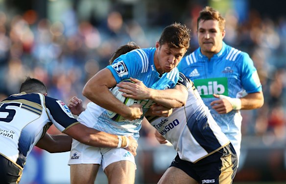 Matt Duffie of the Blues runs the ball.