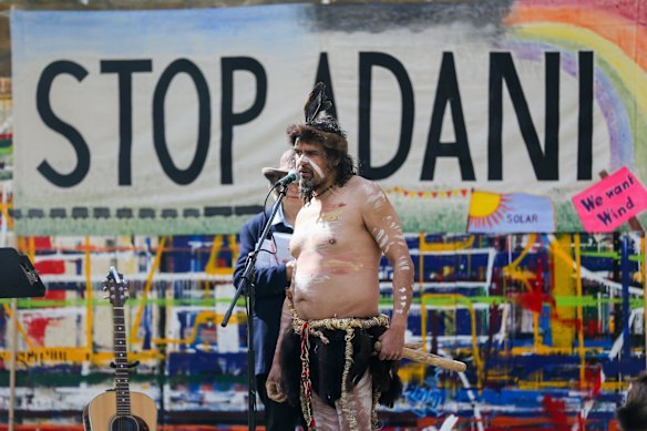 Brett Clarke speaking on stage as a part of the Adani protest at Civic Green, Warrnambool, Vic.