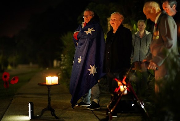 People pay their respects on Anzac Day in Melbourne, Saturday, April 25, 2019. 