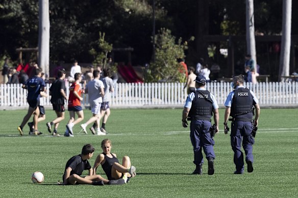 Police patrol Gore Hill Oval in St Leonards during COVID lockdown.