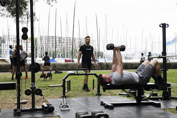 People exercising in Rushcutters Bay Park.