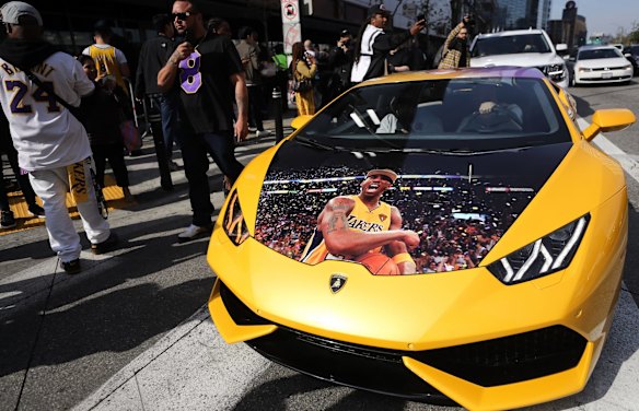 A sports car decorated with Kobe Bryant designs parked outside the Celebration of Life for Kobe and Gianna Bryant memorial service.