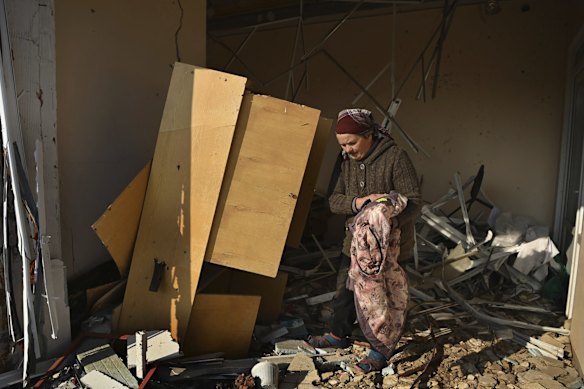 In Bilozirka village, Tetyana Zamozhnya, 60, cleans up at the medical clinic where she works. It was severely damaged by a Russian strike. Bilozirka was liberated in March from Russian occupation but the threat of missile attacks remains.