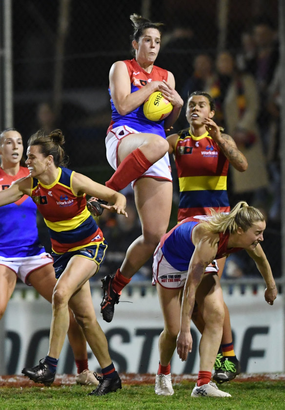 Melbourne’s Lauren Pearce marks strongly.