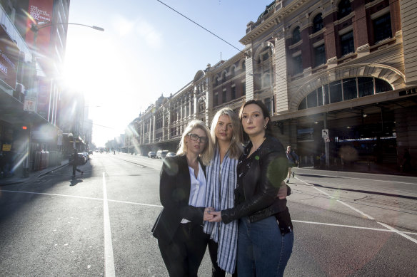 Staff members from Think Talent return to the spot on Flinders street where they were injured last year in the Flinders street attack. (L to R) Ainsley Johnstone, Cara Mullan and Natalie Firth.