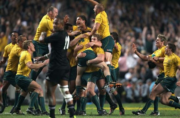 The Wallabies celebrate at the final whistle.